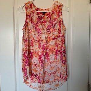 Women’s orange and pink blouse.